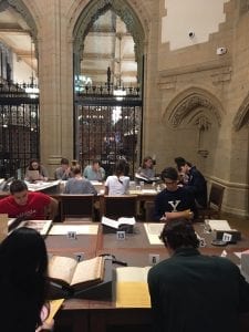 Students in Prof. Jay Gitlin's Yale and America class exploring Manuscripts and Archives collection materials in the Gates Classroom.